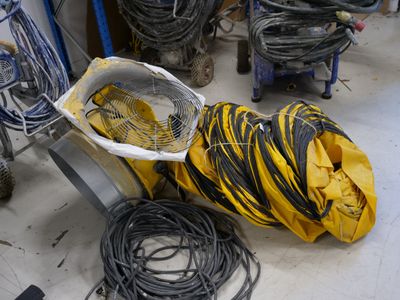 a pile of wires on the floor in a room