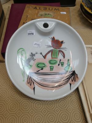a white plate with a picture of a cat on it