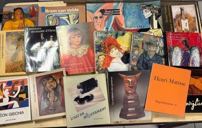 many books that are on a table together