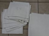 a lot of white napkins on a tiled floor