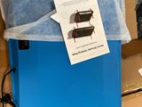 a blue box with a blue sheet of paper on top of it and a blue box with a blue sheet of paper on top of it