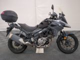 a motorcycle that is parked on a checkered floor