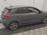 a picture of a grey car parked in a garage