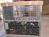 a metal cart with bottles of wine on it in a warehouse