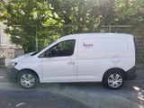 a white van that is parked on the side of the road