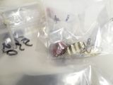 a plastic bag filled with various types of fishing lures