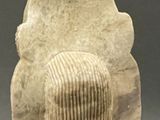 a statue of a person with a hat on it ' s head