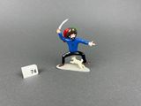 toy figurine of a man with a sword in his hand