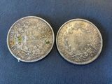 two silver coins, one of which has been cleaned and the other one has been cleaned