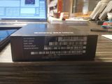 a box that is sitting on a table with a laptop in the background