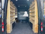 a black van with shelves in the back of it