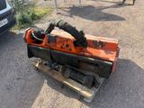 a machine that is sitting on a pallet in the dirt