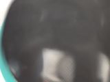 a close up of a stove top with a red light on it