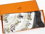 an orange box containing a pair of men ' s handkerchiefs and an orange box containing a pair of men ' s handkerchiefs and an orange box containing a pair