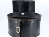 a black top hat sitting on top of a black box