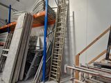 a large room with a lot of shelves and ladders in it