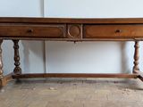 a wooden table with a drawer on top of it