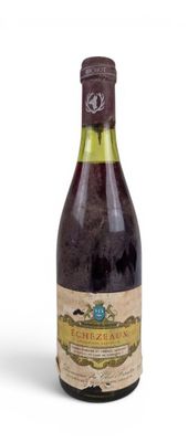 a bottle of wine that is sitting on a table