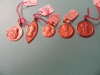 five medals that are on a blue surface