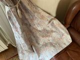 a dress hanging on a chair in a living room