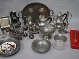 a lot of silver items that are on the table