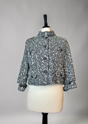 a black and white jacket on a mannequin mannequin mannequin mannequin mannequin mannequin mannequin mannequin mann