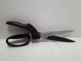 a pair of scissors sitting on a white surface