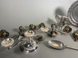 a lot of silver objects that are on the table