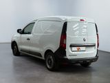the white van is parked in the empty room of the building