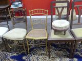 six chairs and a table in a room with red walls