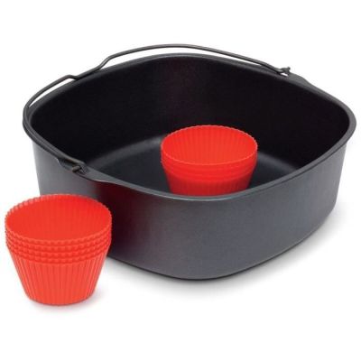 two red cupcake cases in a black pan