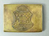 a close up of a metal plaque with a crown on it