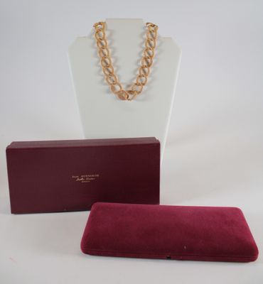 purple velvet case with gold chain necklace and red velvet case