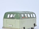 a toy bus that is sitting on a white surface