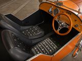 an orange and black car with a steering wheel and dashboard