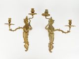 pair of antique brass wall sconces with figures on them
