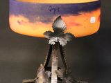 an image of a lamp with a bird on top of it