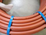 a large orange hose that is on the floor