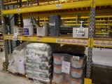 many cans of paint on the shelves in the warehouse