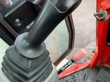 a close up view of a car ' s steering control knob