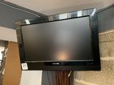 a flat screen tv mounted on a wall in a room