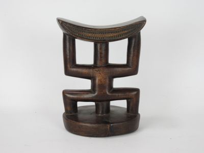 an image of a wooden stool sitting on top of a white surface