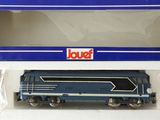the train is blue and white with a red box on top of it
