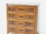 a wooden chest of drawers with a marble top