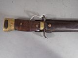 a knife that is laying on a table