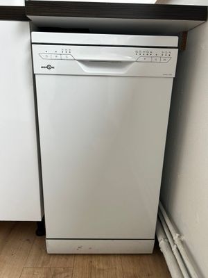 white dishwasher sitting in a kitchen next to a window