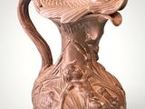 a brown vase with a dragon on it on a white surface