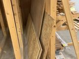 several pieces of wood are stacked on top of each other in a room