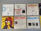 six cds of michael pollaneff ' s album are on a table