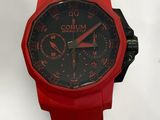 the watch is red and has black dials on it